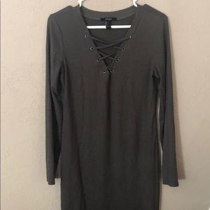 Tight, dark green dress